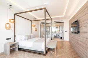 a bedroom with a white bed and a mirror at ATTICA21 VIGO 4 Superior in Vigo