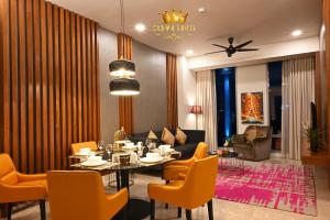 a dining room with a table and chairs at Crown Suites Tropicana The Residence KLCC Bukit Bintang Kuala Lumpur in Kuala Lumpur