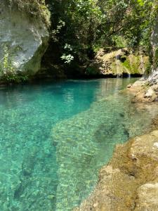 a pool of blue water in a river at Villa Pantalica lato Sortino in Sortino