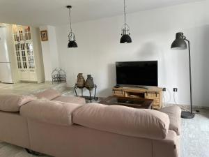 TV a/nebo společenská místnost v ubytování Casa Adosada Familiar