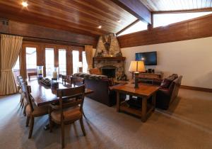 a living room with a dining table and a fireplace at Flagstaff Two Bedroom apartment hotel in Park City