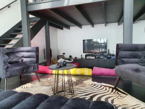 Posedenie v ubytovaní EXIGEHOME-Magnifique Loft à 15 minutes de Paris