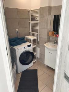 Kúpeľňa v ubytovaní White Apartments - Free parking + 10 fotografií