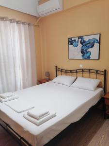 Posteľ alebo postele v izbe v ubytovaní Spacious Apartment Archidamoy 114