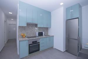 A kitchen or kitchenette at Poris 3 Beachfront Corralejo By Holidays Home