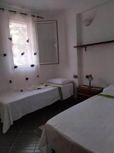 Posteľ alebo postele v izbe v ubytovaní Casa Leonardo