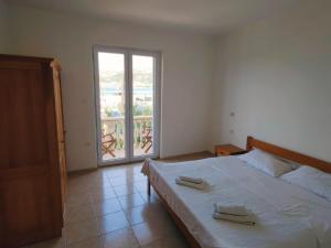 Postel nebo postele na pokoji v ubytování Apartments Prosika