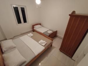 Postel nebo postele na pokoji v ubytování Apartments Prosika