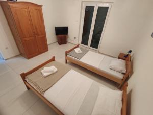 Postel nebo postele na pokoji v ubytování Apartments Prosika