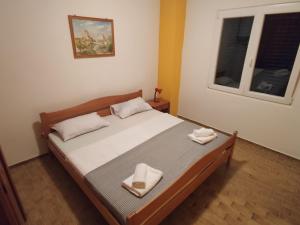 Postel nebo postele na pokoji v ubytování Apartments Prosika