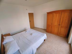 Postel nebo postele na pokoji v ubytování Apartments Prosika