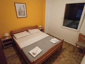 Postel nebo postele na pokoji v ubytování Apartments Prosika
