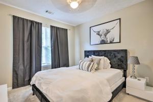 a bedroom with a large bed and a window at Boho Union City Home Less Than 20 Mi to Dtwn Atlanta! in Union City