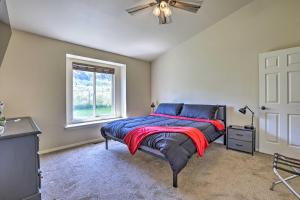 a bedroom with a bed and a window at Quiet Nampa Home with Game Room and Hot Tub! in Nampa