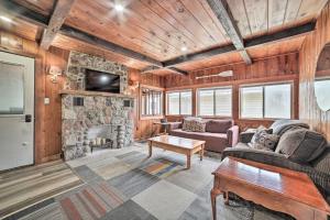 A seating area at Cozy Prudenville Cabin Walk to Houghton Lake