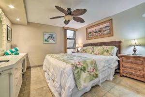 a bedroom with a bed and a ceiling fan at Beachfront Condo Sunset Views and Pool Access! in Kahana