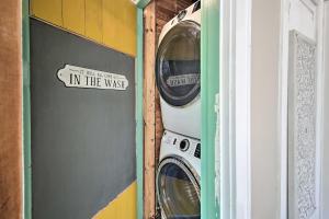 a washing machine and a washer in a room at 2 Mi to Central Ave Quaint Hot Springs Home! in Hot Springs