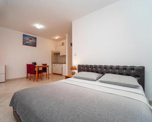 Postel nebo postele na pokoji v ubytování Apartments Baresic
