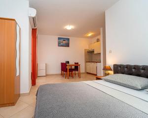 Kuchyň nebo kuchyňský kout v ubytování Apartments Baresic
