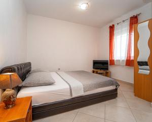 Postel nebo postele na pokoji v ubytování Apartments Baresic