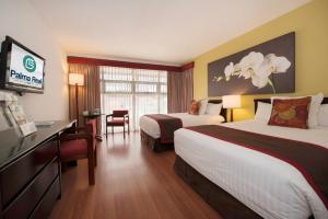 Ένα ή περισσότερα κρεβάτια σε δωμάτιο στο Hotel Palma Real