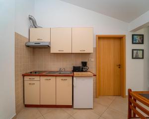 Kuchyň nebo kuchyňský kout v ubytování Apartments Baresic