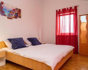 Postel nebo postele na pokoji v ubytování Apartments Baresic