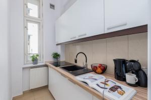 Kuchyňa alebo kuchynka v ubytovaní Brzozowa Apartments by Hostly