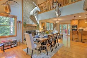 a dining room with a table with deer heads on the wall at Secluded Leesburg Retreat with Private Hot Tub! in Middleburg