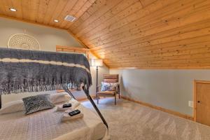 a bedroom with a bed and a wooden ceiling at Secluded Leesburg Retreat with Private Hot Tub! in Middleburg