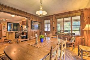 a dining room with a wooden table in a room at Rustic Roxbury Ski Farmhouse with Trails! in Roxbury