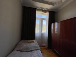 Letto o letti in una camera di Family Hotel 7 Sisters