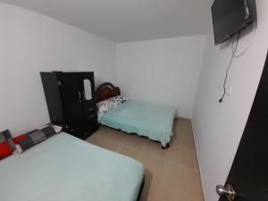 Cama o camas de una habitación en ARBOLEDA CAMPESTRE ALGARROBO