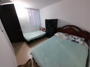 Cama o camas de una habitación en ARBOLEDA CAMPESTRE ALGARROBO