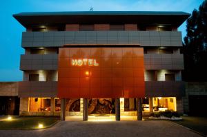 a building with a hotel sign in front of it at Paredes Design Hotel in Paredes