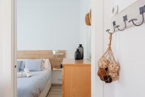 A bed or beds in a room at LLAFRANC 100 - calle Coral-