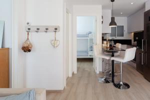 A kitchen or kitchenette at LLAFRANC 100 - calle Coral-
