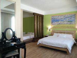 Postel nebo postele na pokoji v ubytování Hotel Balik Pulau