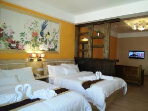 Postel nebo postele na pokoji v ubytování Hotel Balik Pulau