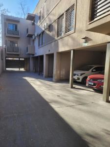 an empty parking lot in front of a building at Moderno Departamento con cochera in Mendoza