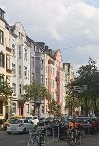 a street with buildings and bikes parked on the street at Down-Town-Oasis in Düsseldorf