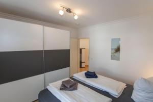 Ένα ή περισσότερα κρεβάτια σε δωμάτιο στο Deutsches Haus