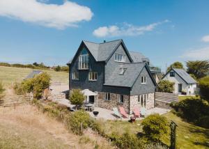 a large house with a black roof at Daydreamer Cottage in Padstow