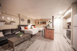 a living room with a couch and a bed at Stay Together Suites in Las Vegas