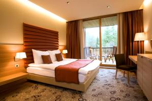 
A bed or beds in a room at Hotel Balnea Superior - Terme Krka
