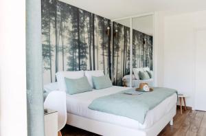 Cama ou camas em um quarto em La Cabane du Ferret