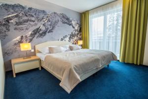 Posteľ alebo postele v izbe v ubytovaní Hotel Slovan