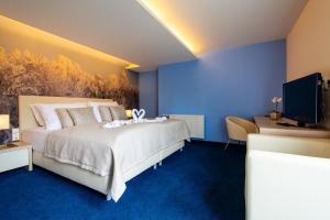 Posteľ alebo postele v izbe v ubytovaní Hotel Slovan