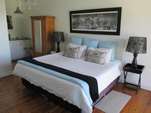Ein Bett oder Betten in einem Zimmer der Unterkunft Radium Hall Guest House