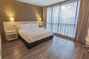 Postel nebo postele na pokoji v ubytování Sonesta Hotel Ibagué
